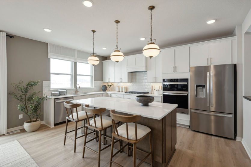 A modern chef’s kitchen with an island that’s perfect for meal prep or casual dining.