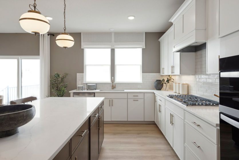 A modern chef’s kitchen with an island that’s perfect for meal prep or casual dining.