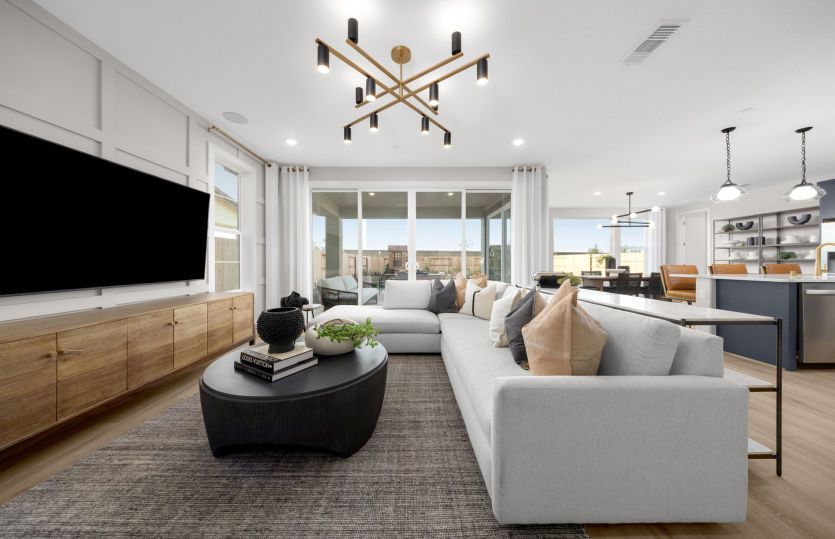Gathering room with access to covered patio and backyard