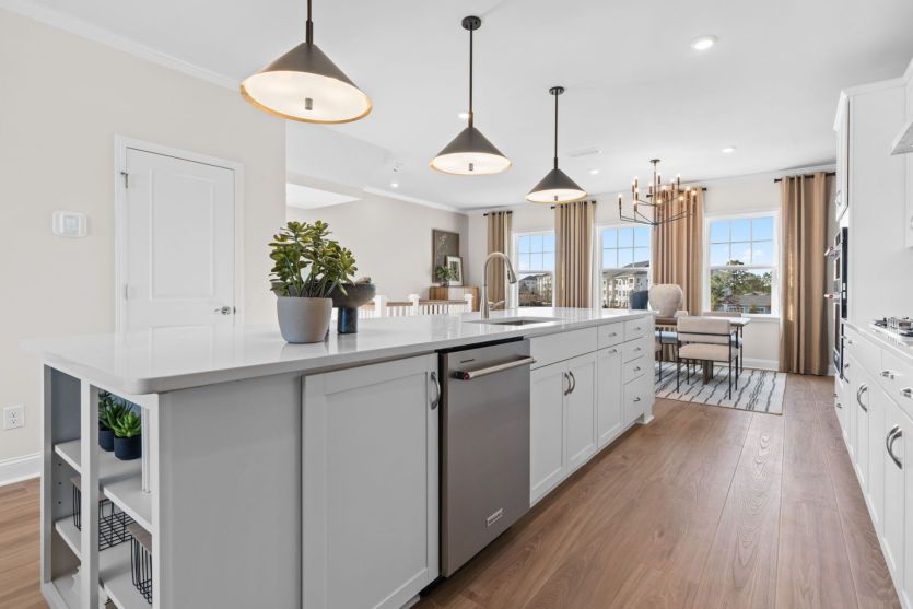 Shelves at the end of Kitchen Island. Model Home Representation.