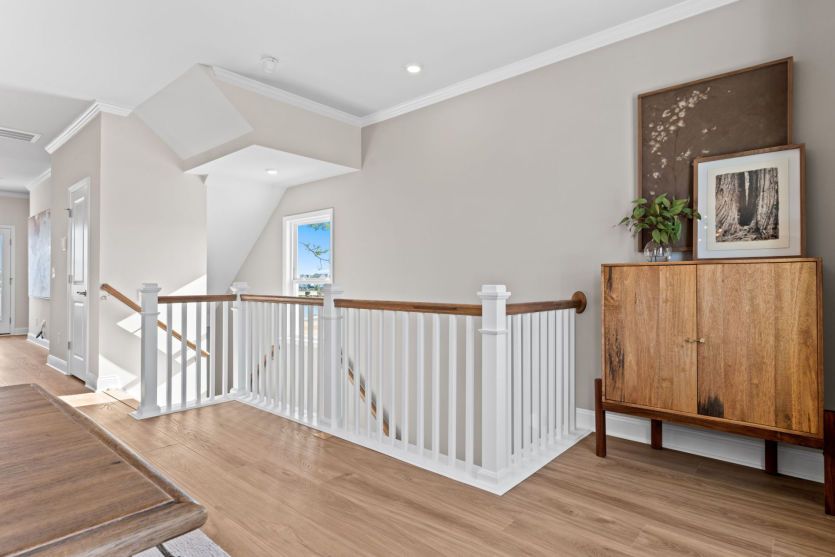 Stairs leading to first floor. Model Home Representation.