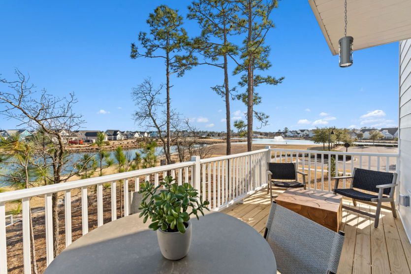 Patio with Lakeside View. Model Home Representation.