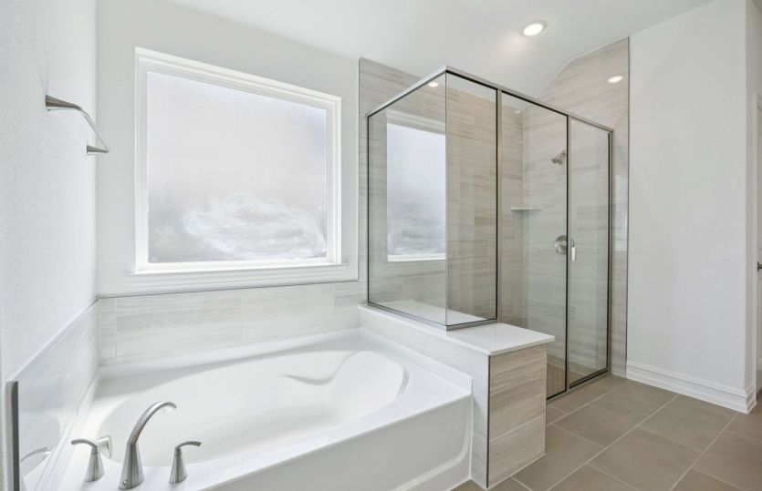 Private owner's bath with tub and shower