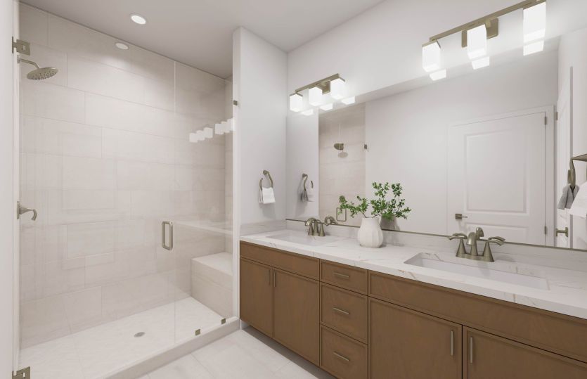 Primary Suite Bathroom with a Dual Vanity Sink and Walk-In Shower with Tiled Floor