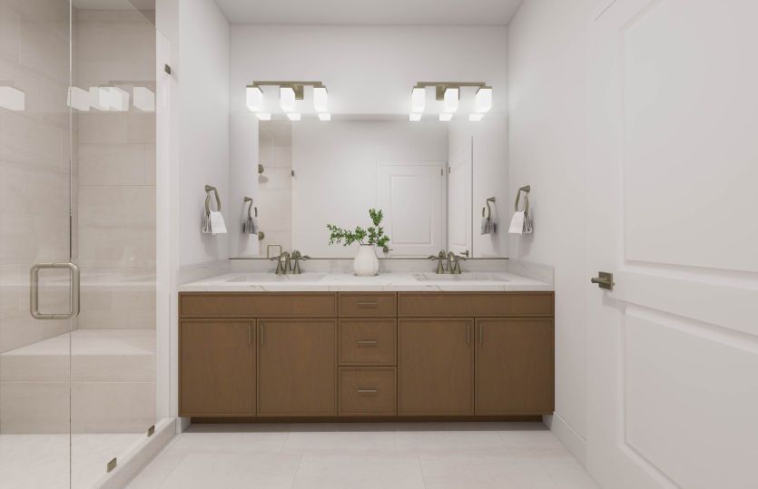Primary Suite Bathroom with a Dual Vanity Sink and Walk-In Shower with Tiled Floor