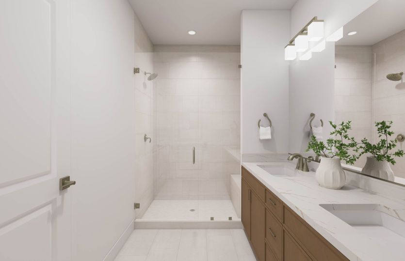 Primary Suite Bathroom with a Dual Vanity Sink and Walk-In Shower with Tiled Floor
