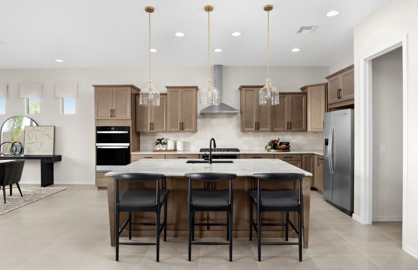 Built-in stainless steel appliances complete the upscale Ravenna kitchen at Savio Ridge.