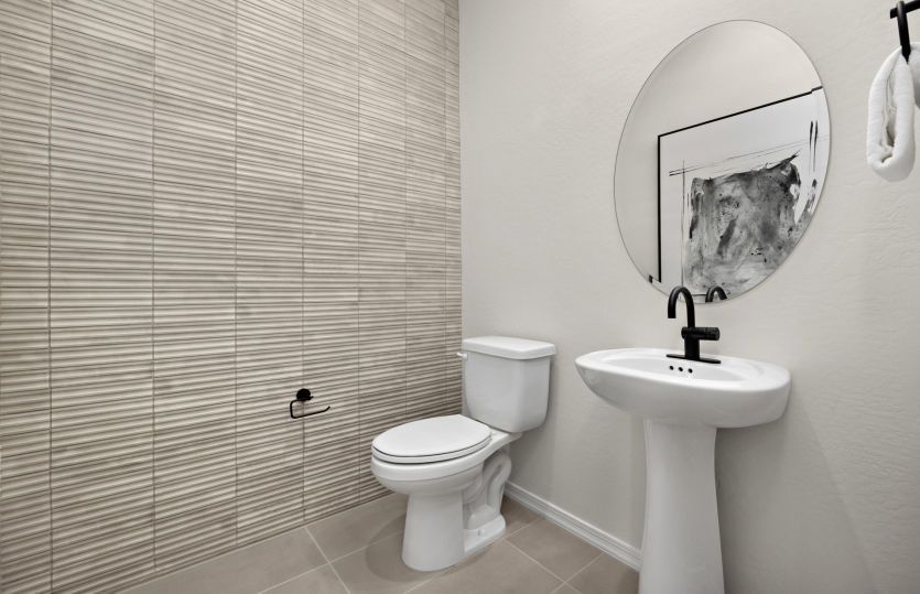 Powder bath off the gathering room is convenient for hosting guests.