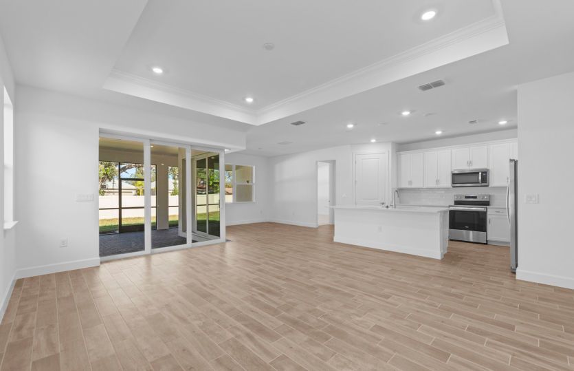 Spacious gathering room featuring a drop tray ceiling