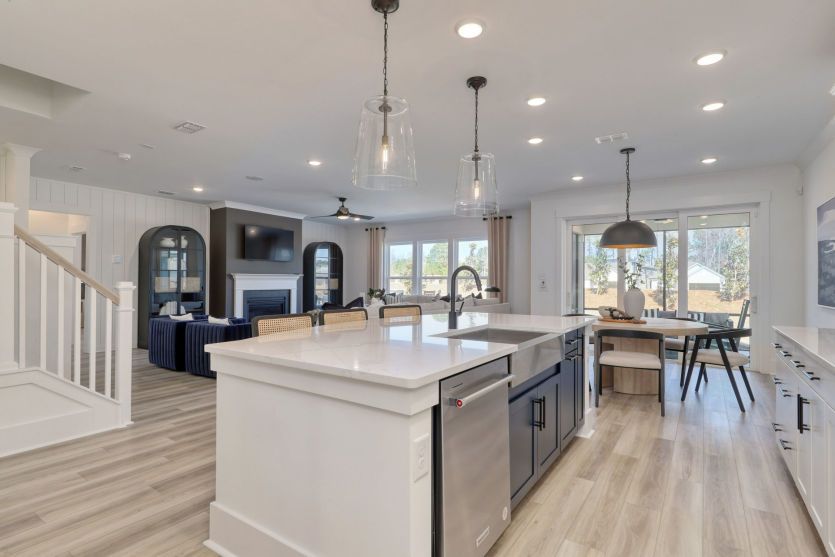 Gourmet kitchen with large island and seamless flow to the living area.
