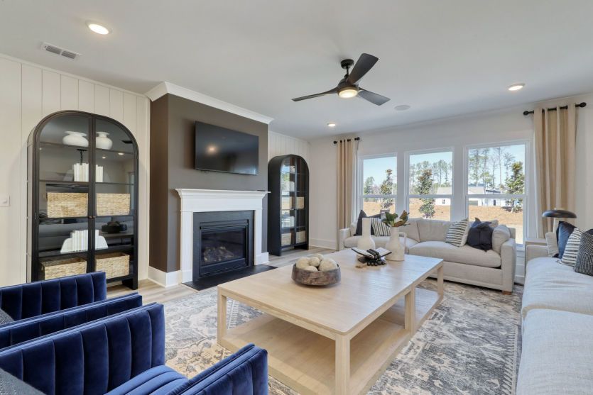 Open living room with abundant natural light and comfortable gathering space.