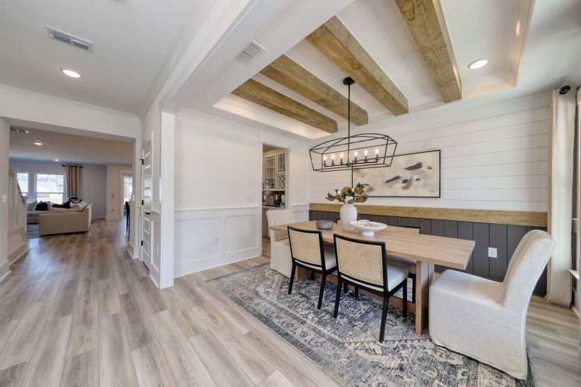 Elegant dining area with open access to the kitchen and living room.