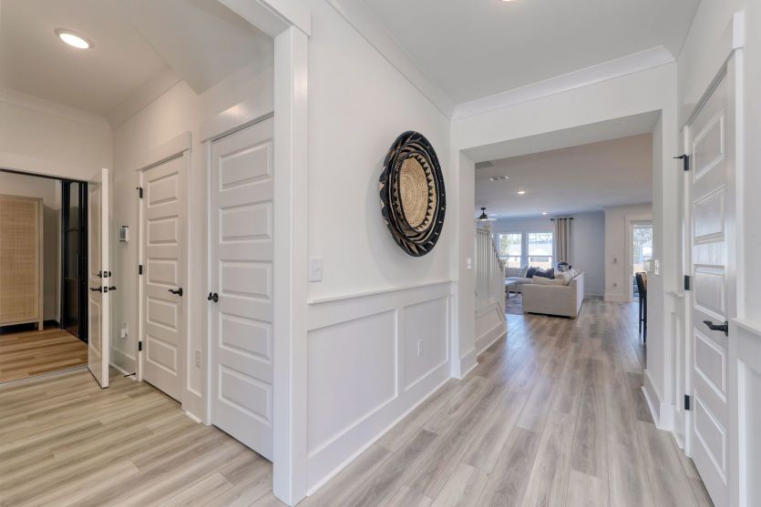Welcoming foyer with open sightlines and stylish architectural details.