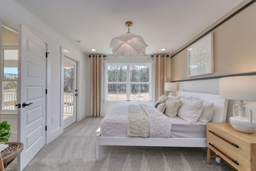 Spacious secondary bedroom with ample closet and natural light.