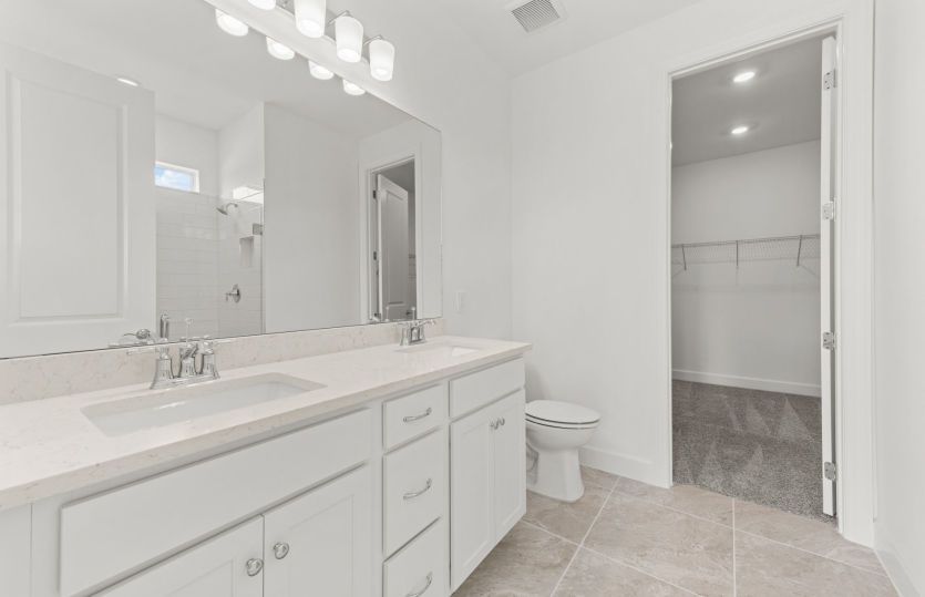 Owner's bathroom with dual-sink vanity