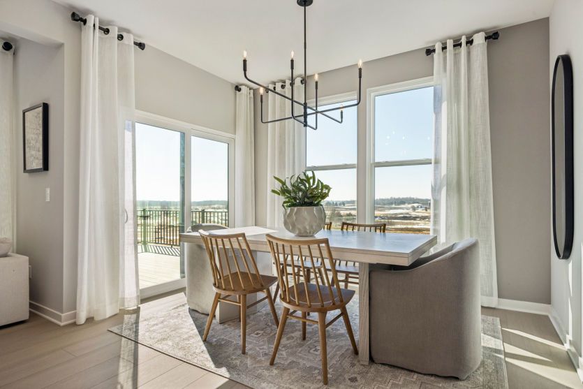 The dining room gazes into the backyard