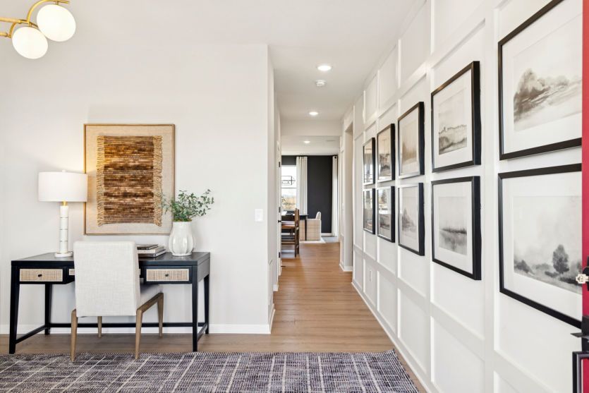 Walk from the main level flex room down the hallway and into the rest of the home