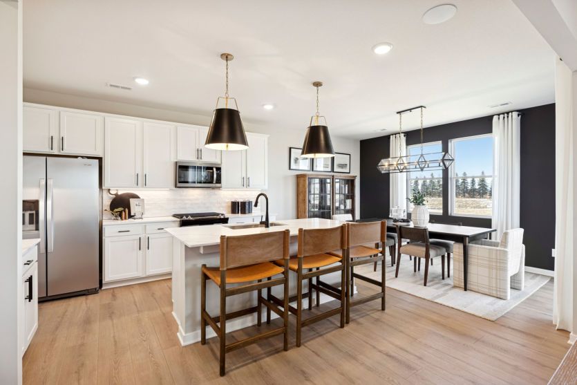 The sprawling kitchen, with the dining room behind it