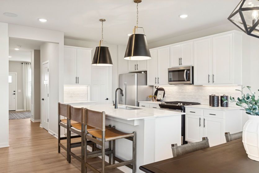 The gorgeous, sunlit filled kitchen
