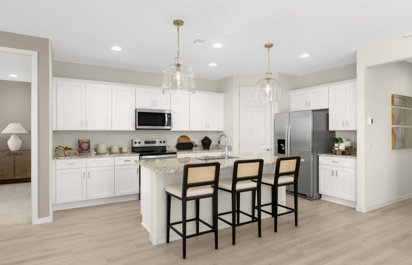 The Nectar kitchen with white cabinetry and optional pendant lighting.