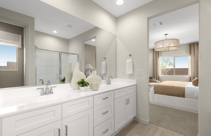 Private Owner's Suite detailed with chrome finishes, dual sinks, and a tile shower.