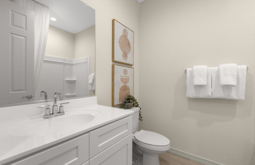 Guest bath with a shower/tub combo and chrome finishes.