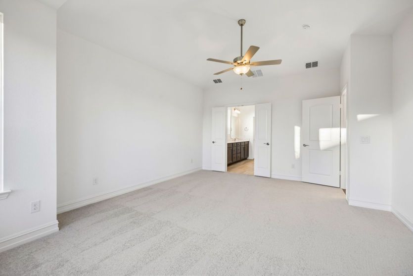 Spacious owner's suite with private bath*photos may depict options and features that aren't availabl