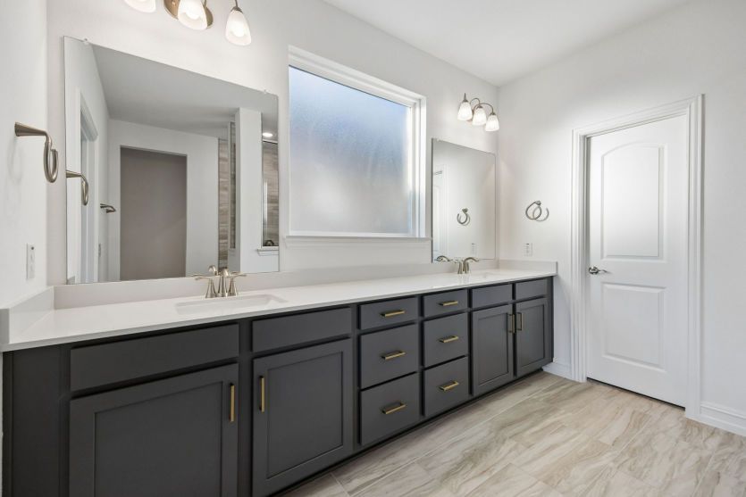 Double vanity in owner's bath *photos may depict options and features that aren't available
