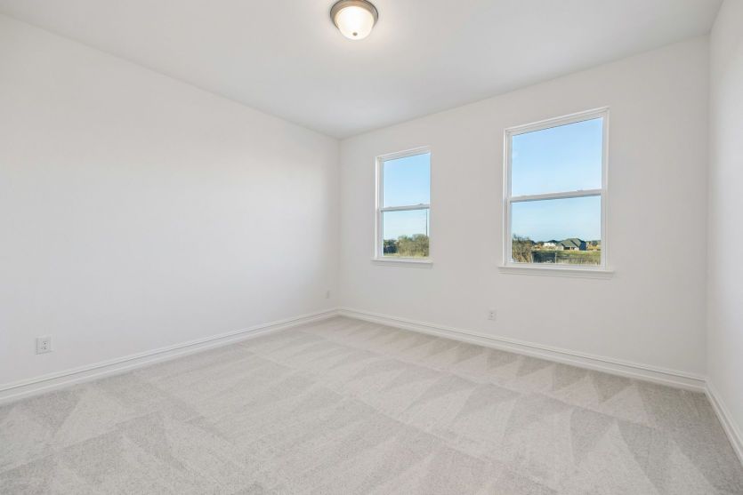 Spacious secondary bedroom *photos may depict options and features that aren't available