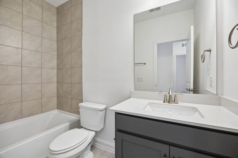 Spacious secondary bathroom *photos may depict options and features that aren't available