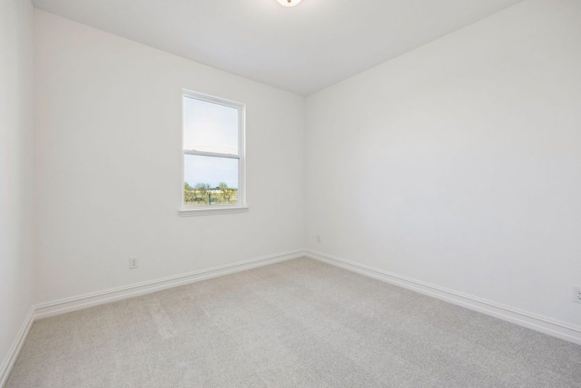 Spacious secondary bedroom *photos may depict options and features that aren't available