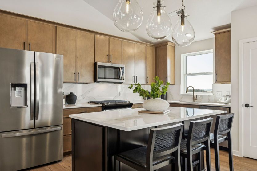 Modern kitchen with sleek finishes and a spacious central island.