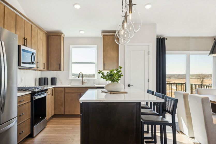 Modern kitchen with sleek finishes and a spacious central island.