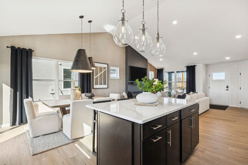 Modern kitchen with sleek finishes and a spacious central island.