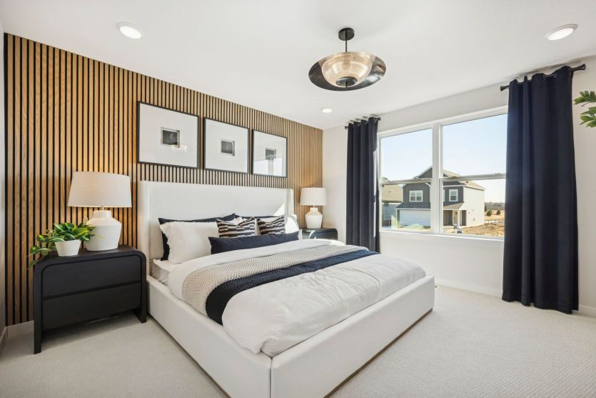 Spacious primary suite with elegant design and serene ambiance.