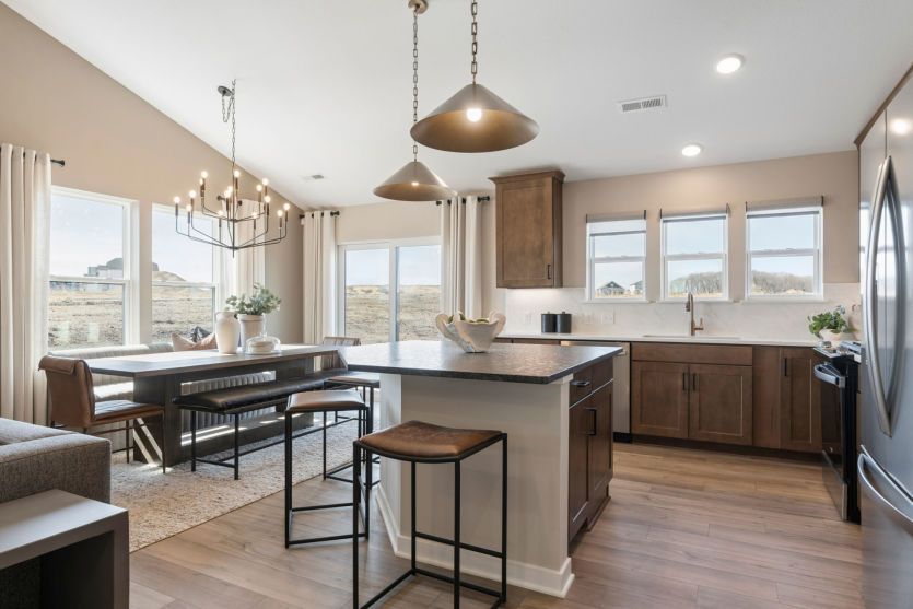 Modern kitchen with sleek finishes and a spacious central island.
