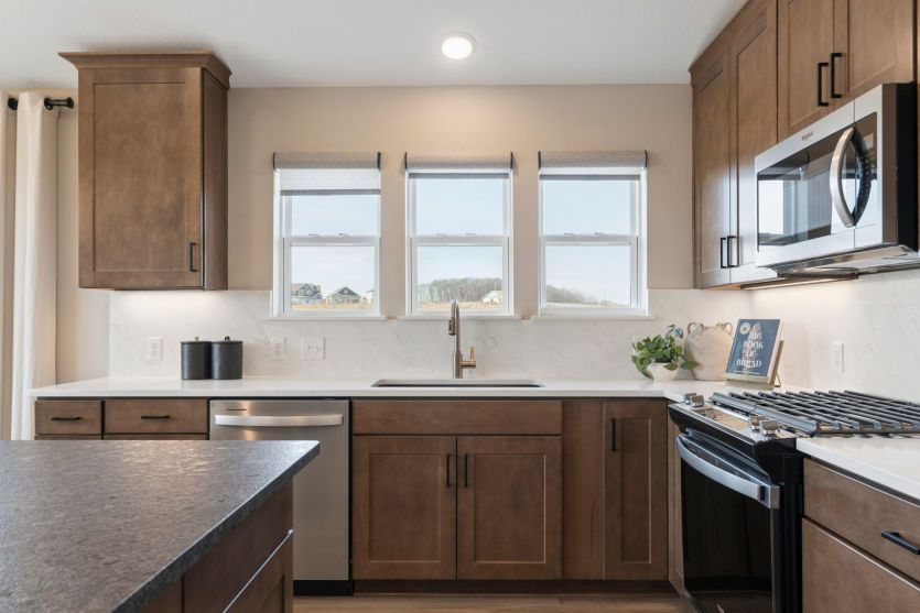 Modern kitchen with sleek finishes and a spacious central island.