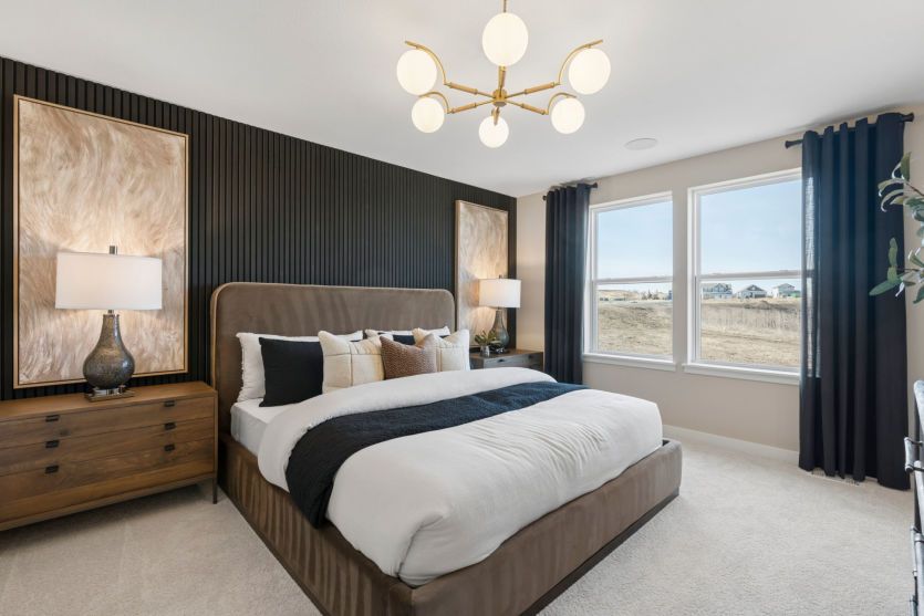 Spacious primary suite with elegant design and serene ambiance.