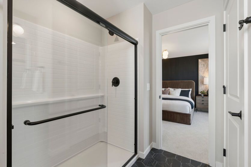 Luxurious primary bath suite with modern finishes.