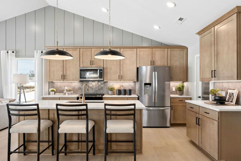 The gathering room, dining room, and kitchen all flow effortlessly together.
