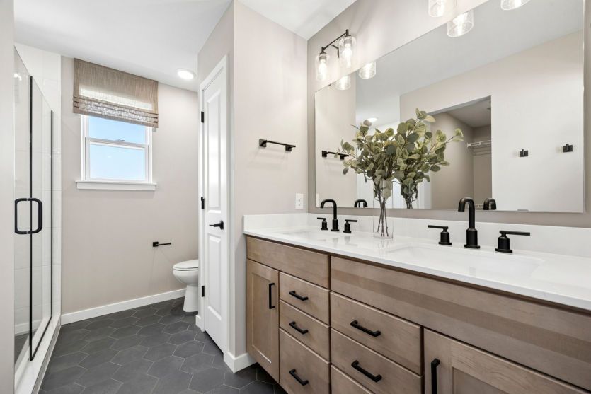 Your primary suite bathroom, perfect for rest & relaxation.