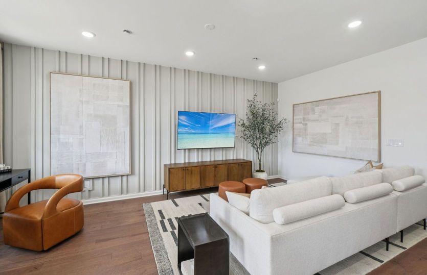 Open gathering area with view of kitchen