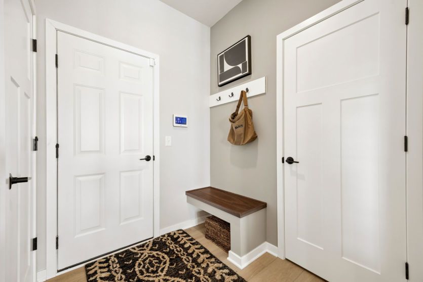 Enjoy the functional boot bench as you walk in from the garage.