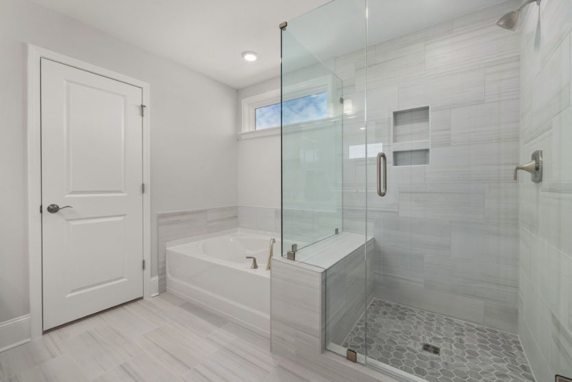 Glass Shower and Large Tub in Owner's Bath