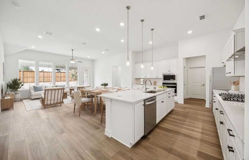 Open-concept kitchen and gathering room in the Azle floorplan with seamless flow for entertaining.