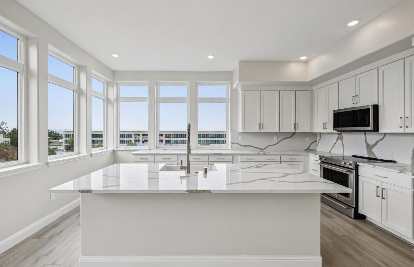 Kitchen with ample storage and an abundance of natural light