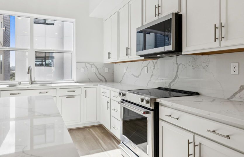Kitchen with white cabinetry