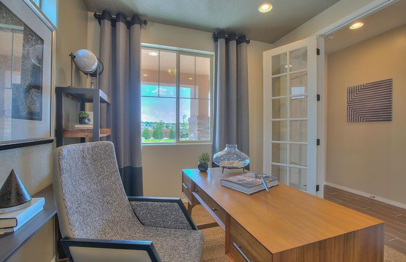 The den turns into an ideal home office when you add French doors, creating privacy while remaining