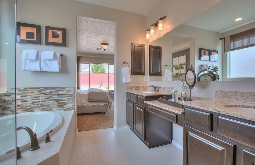 Always have enough space in your owner's bath with dual sinks and lots of cabinets and drawers to ke