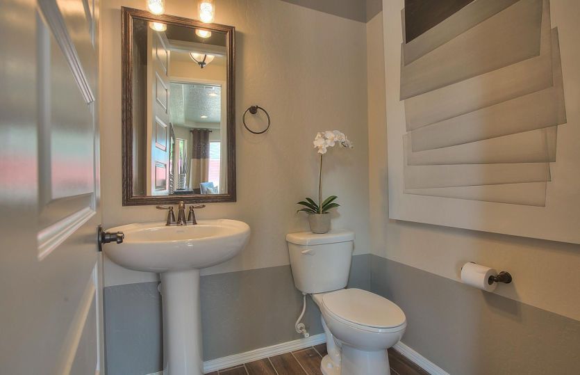 Powder bath on the first floor located just off the gathering room is convenient for guests.